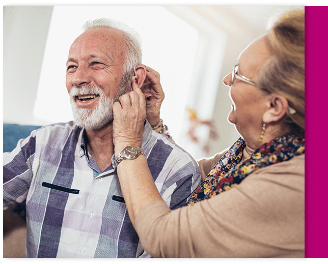 Mature husband and wife trying out their hearing aids through the 7 day test drive service
