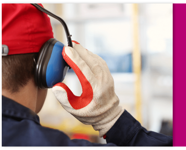 Worker using hearing protection at his job