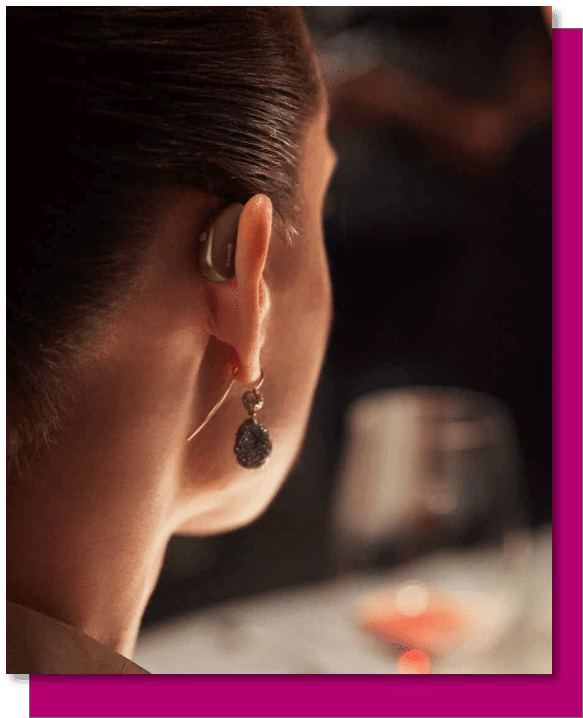 Woman wearing Widex Custom hearing aids